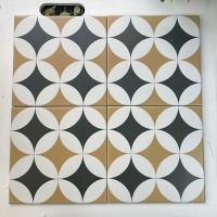 Gạch bông men 20x20 hình tròn nâu đen